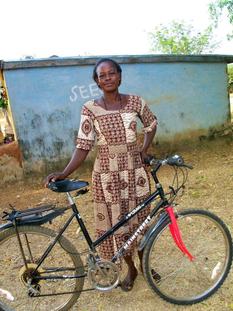 Adongo Alariba An African woman receives her bike from Village Bicycle Project.